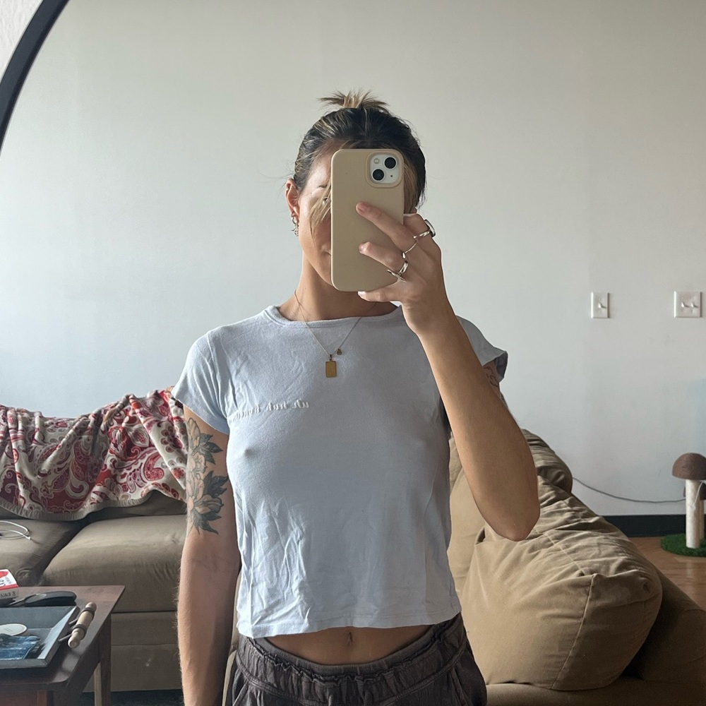 JOHN GALT BABY TEE “UH HUH HONEY”